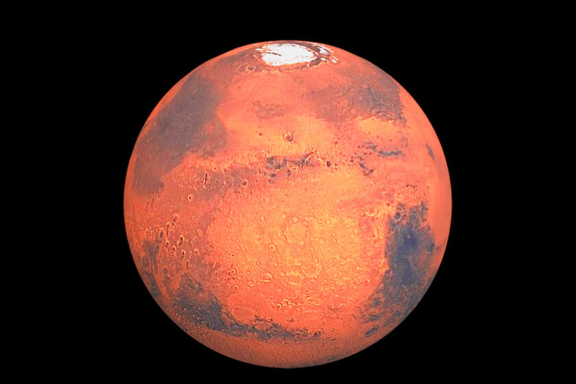 A picture of the planet Mars with the icy north polar cap visible.